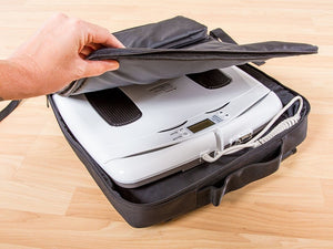 White electronic InBody device being placed into a black carrying case